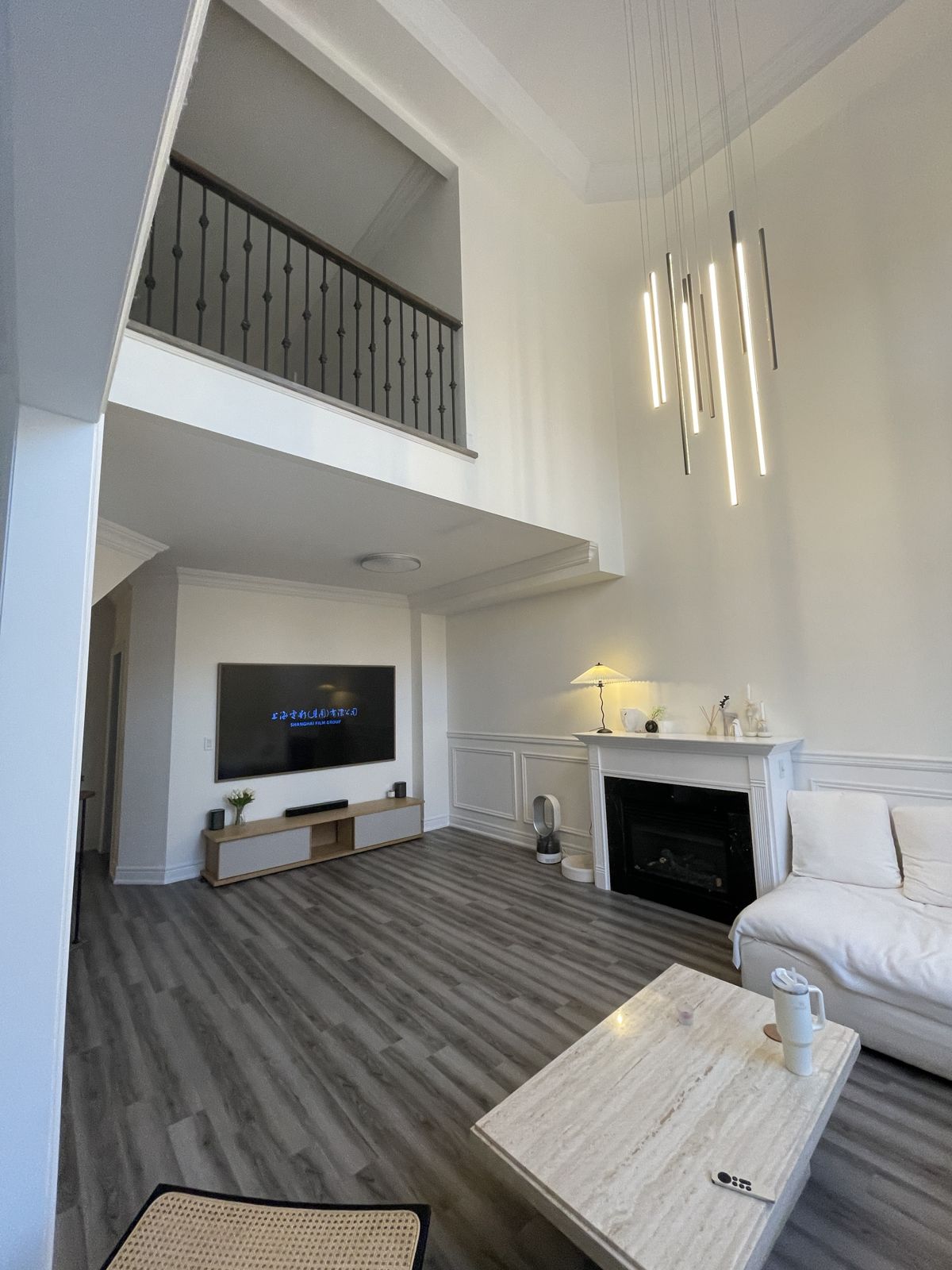 Two-storey living room with new SPC flooring in a Vaughan home